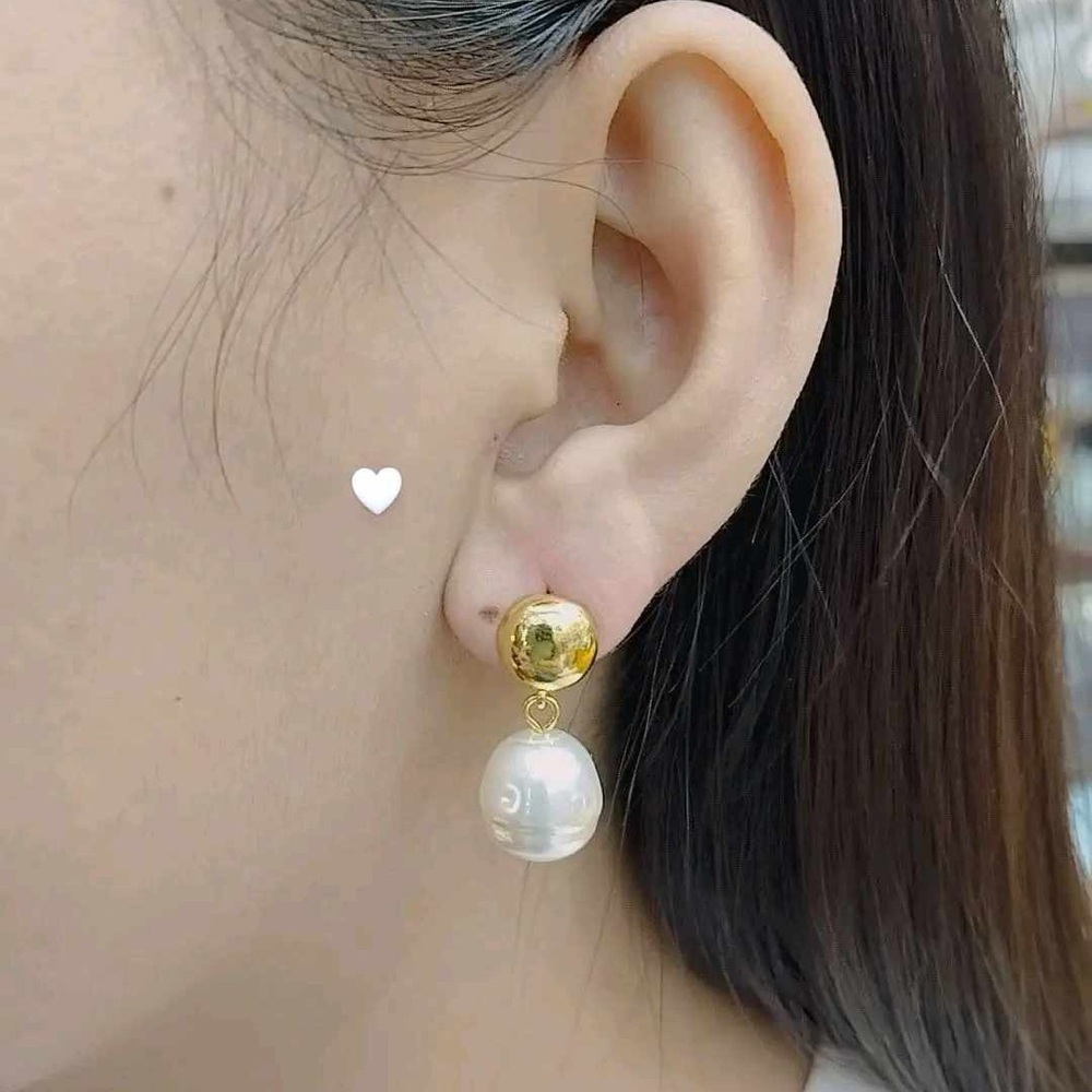 gold-plated pearl earrings with a unique and modern design.